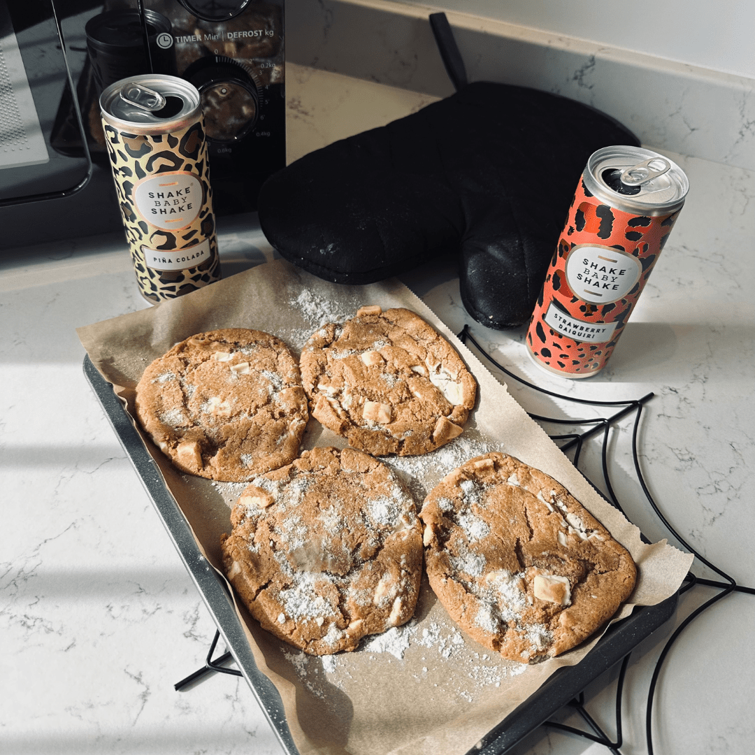 Two cans of Shake baby Shake cocktail with marshmallow cookies