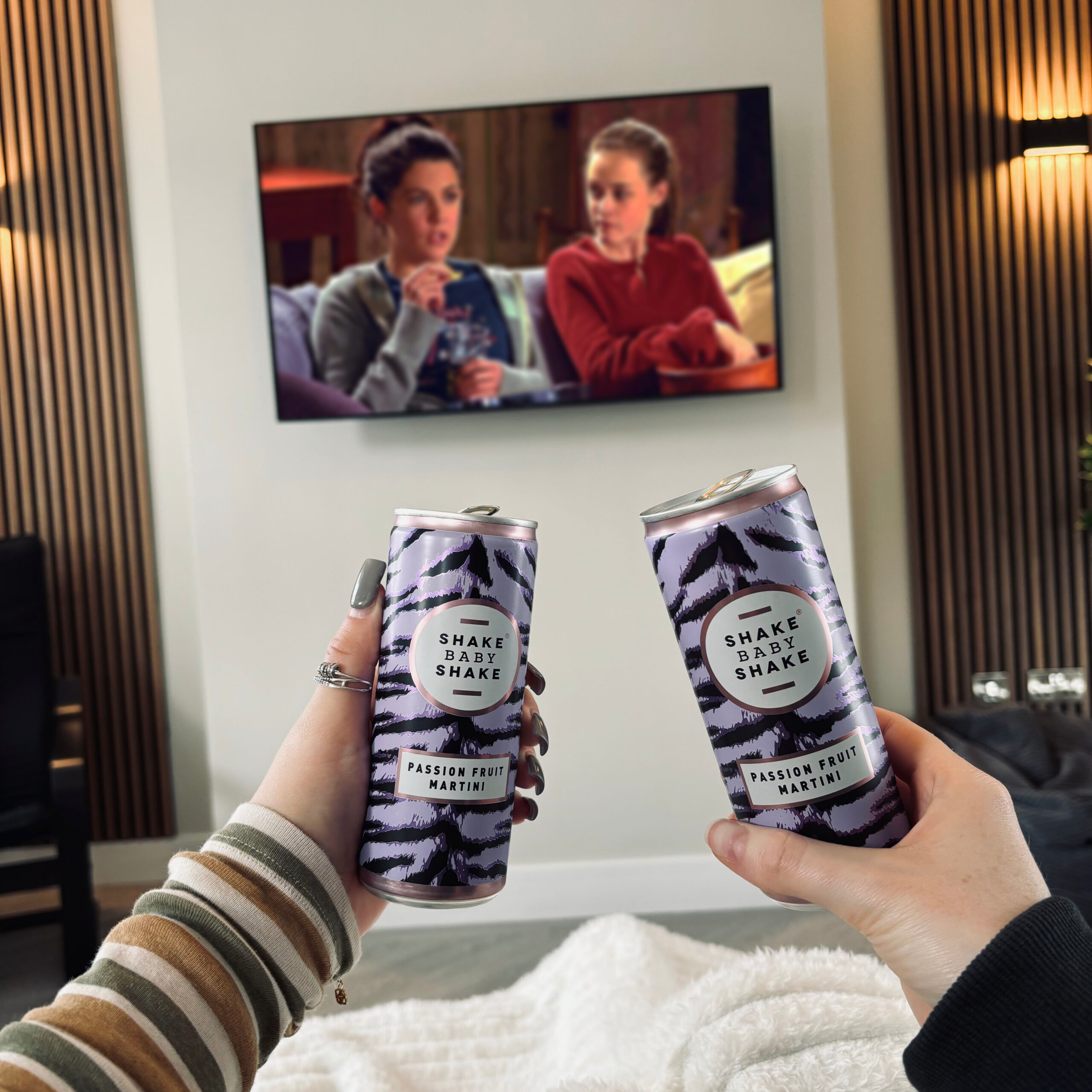 Two cans of Shake baby Shake passionfruit martini watch a movie cosy night in